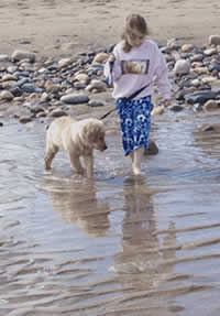 Lyric and Leah walk the beach